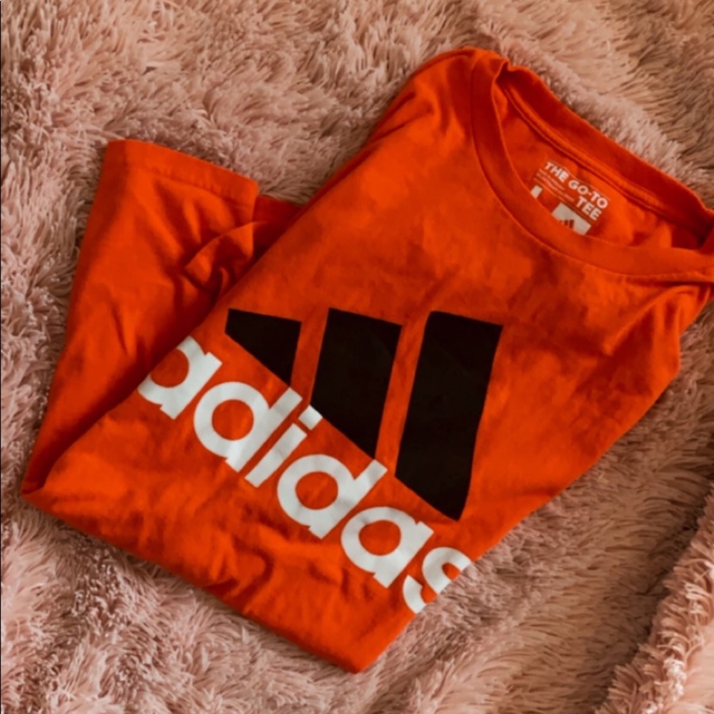 orange adidas shirt large logo